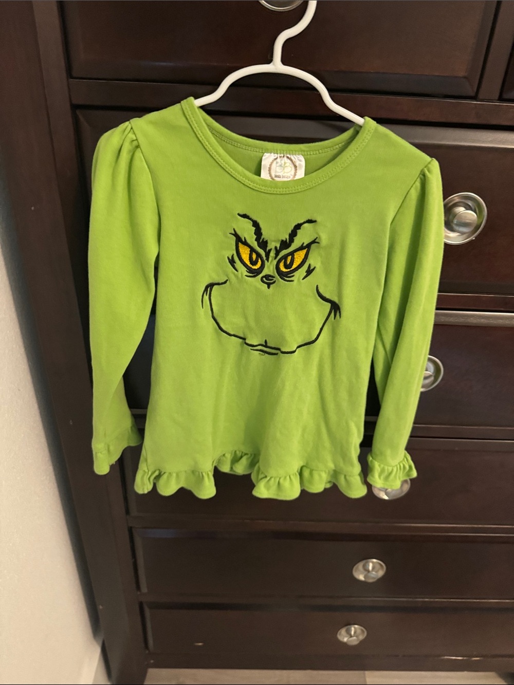 Girls' Bright Green Long-Sleeve Ruffle Tee with Grinch Face Graphic